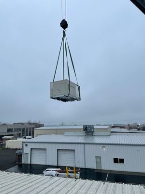 Setting a commercial rooftop dual pack unit