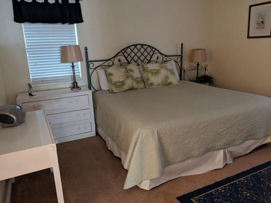 Master bedroom with king size bed.