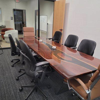 Conference room comfortably seats 10, has wireless display and private entrance to parking lot for super easy meetings