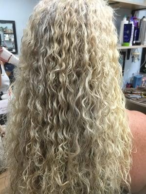 Spiral perm on long hair.