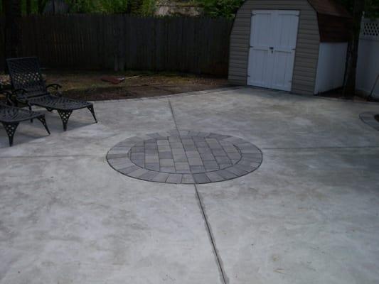 Concrete patio with paver accents