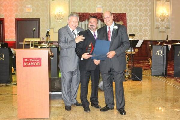 Dr. David Barrett receiving an award from the East Hanover Italian American Club recognizing him as Entrepreneur of The Year