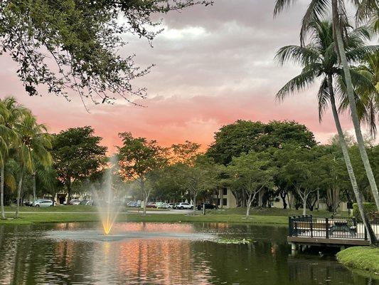 Sunset over lake next to pool