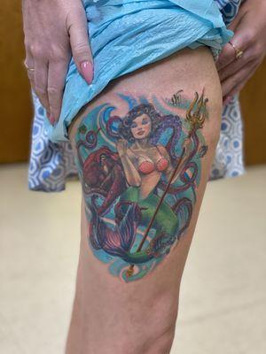 This is a pinup influenced mermaid with a friendly octopus and happy little fishies! Done by Jeremie Miller, owner of Tanuki Tattoo Studio.