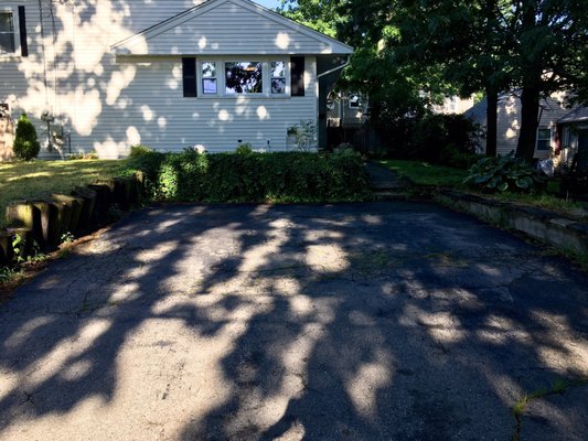 What the walls and driveway looked like before. The walls were cutoff telephone poles.