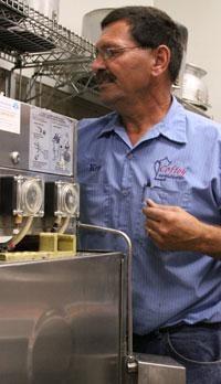 Ken working on a dishwasher.