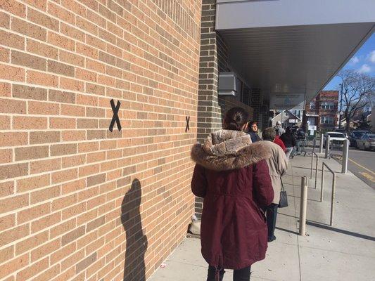 X marks the spot where to wait in line while social distancing to get in the store.