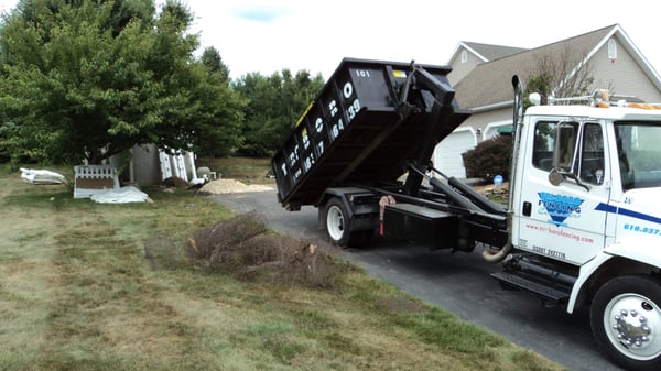 Dumpster being dropped for a home cleanout