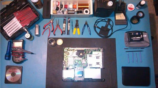 The "operating table" for PCB repair and computer disassembly.