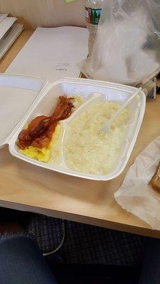 3 pieces of cold bacon, cold toast with unmelted butter.  Flavorless grits and runny eggs.