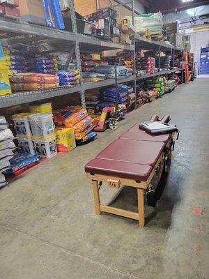 Table set up in a warehouse to adjust patients at their place of work.