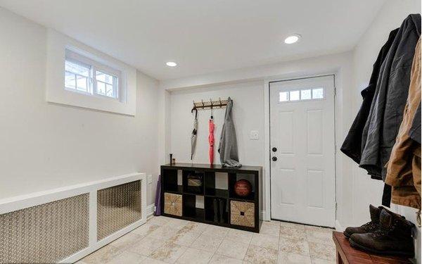 Mudroom with custom radiator cover