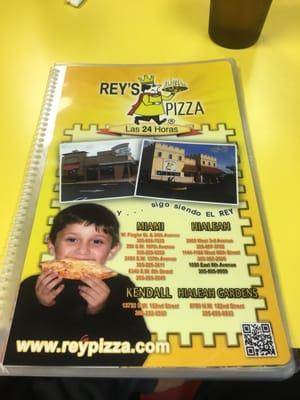 All the locations of Reys pizza around Miami on the front of the menu. Side note do you think that's "Rey's" grandson on front?!