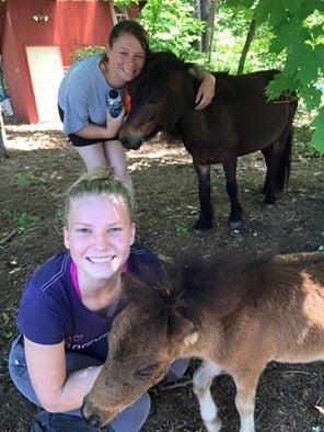 Riding Director Katie with Mocha and Camper Lauren visiting with baby Sorpresa! Our newest mini farm residents!