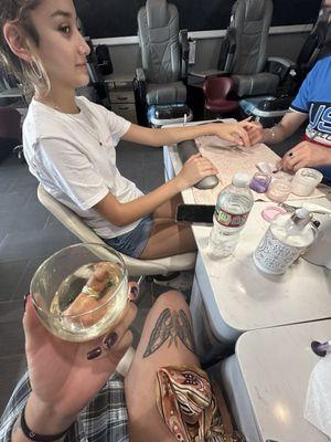 Me and the baby got our nails done and they offered a glass of wine