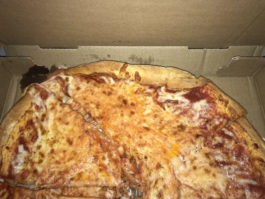 This is how our pizza looked when it was delivered. The cheese was sliding to one side and was all sloppy and messy.