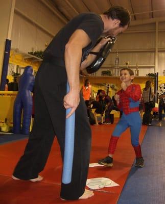 Sensei Heath Roughton defends himself against Spider-Man at the annual Howl-A-Palooza event