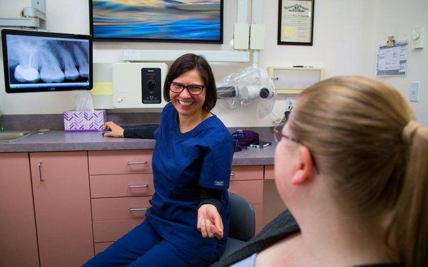 Dental hygienist explaining root canal procedure at Family Dental of Spokane