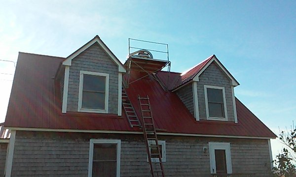 Chimney Liners being Installed.Customer has a New Metal Roof and the scaffolding setup we used did Not leave any fastener holes or marks!