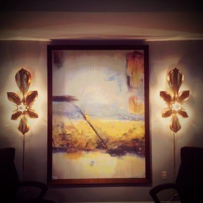 Sconces and artwork behind our NEW reception counter!