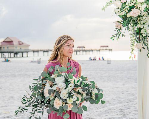 HIlton Clearwater BEach Wedding with True Love Photography. Bridesmaid holding bouquets.