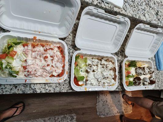 Chicken over rice, lamb over rice, & falafel over rice. $8 each with a can of soda.