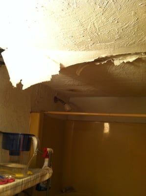 unit above mine leaky toilet leaked into my bathroom, ceiling partial colapse