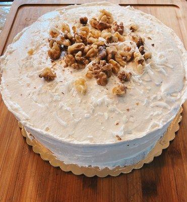 What lies beneath the billowy cream cheese buttercream is... carrot cake.