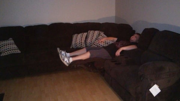 My Husband Reclining on Our New Sofa