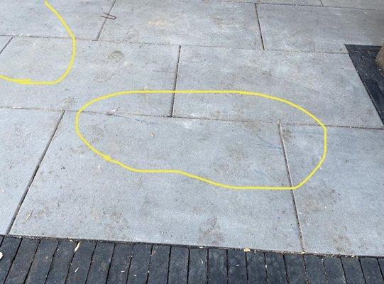 Scratches, chips and blue marks on pavers.