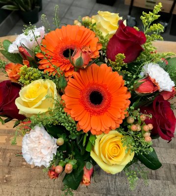 Fall accents give the "Citrus Kissed" Bouquet a fun, seasonal twist.