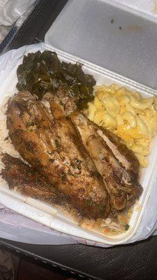 Turkey wings with rice/dressing, collard greens, and Mac & Cheese.