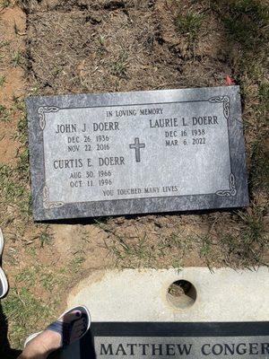 The Doerr family head stone. Just laying in the dirt, crooked and unfinished.