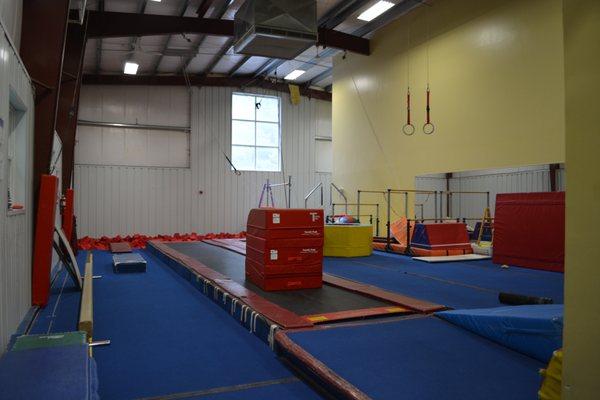 Back gym which includes the pit, preschool bars, and tumbl trak.