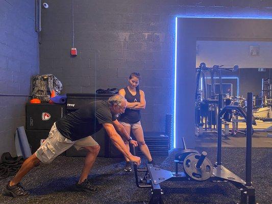 Trish Phan working on leg strength and core stability with Steve a retired Navy Sub Operator.