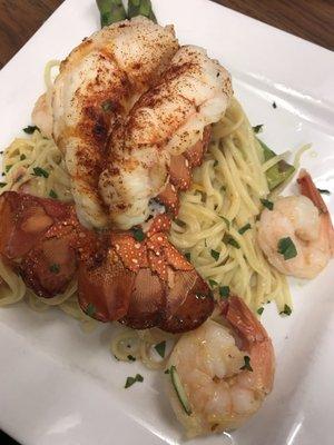 Enjoying tonight special lobster tail with shrimp over pasta, join us for good food and wine