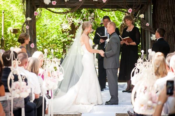 The arbor was simply breathtaking.... a floral chandelier, draped with crystals and decorated with flowers....