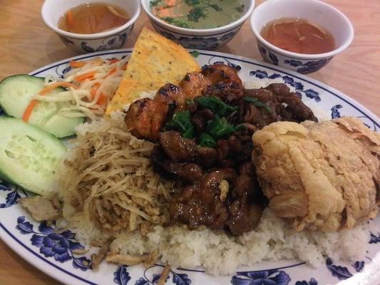 Broken rice with grilled pork and shrimp, shredded pork, egg cake, and shrimp cake