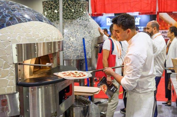 Fresh pies going in our Morello Forni pizza ovens at this years International Pizza & Pasta Expo. Available for demo in our test kitchen!