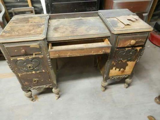 This desk is in bad shake need lots of repair and refinish