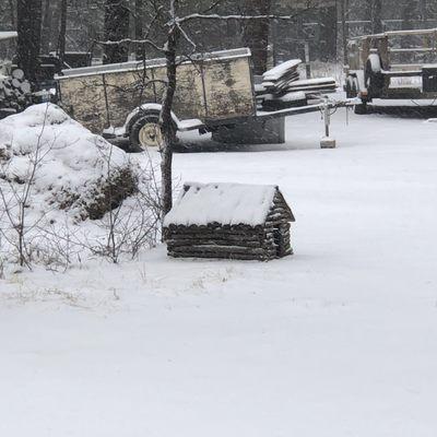 Snow-covered mini dog cabin!