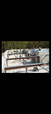 Block foundation with structural steel framing.