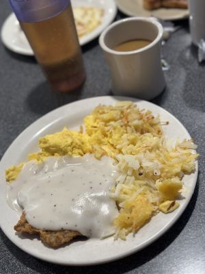 Country fried steak eggs and potatos