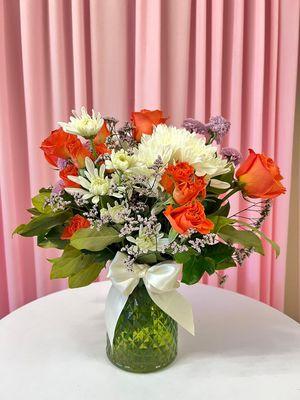 Orange crush- beautiful orange roses complemented with white lilies