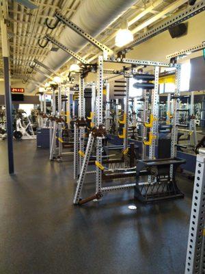 Unloading custom gym equipment from the freight truck, carrying it in, and assembling it.