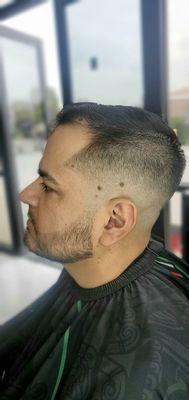 Mid Bald Fade w/ Beard line up and trim.