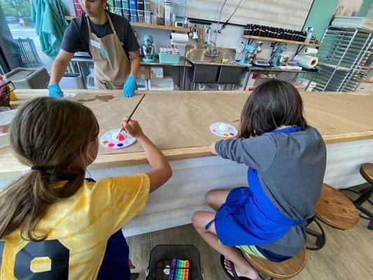 Kids can paint a bath bomb for free.