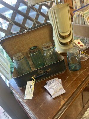 Ball jars sitting inside a 1930's suitcase!