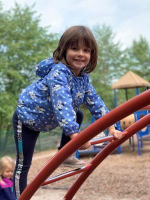 Exploring the large muscle equipment on our playground.