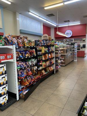 Chips aisle with cafe and bakery items beyond.